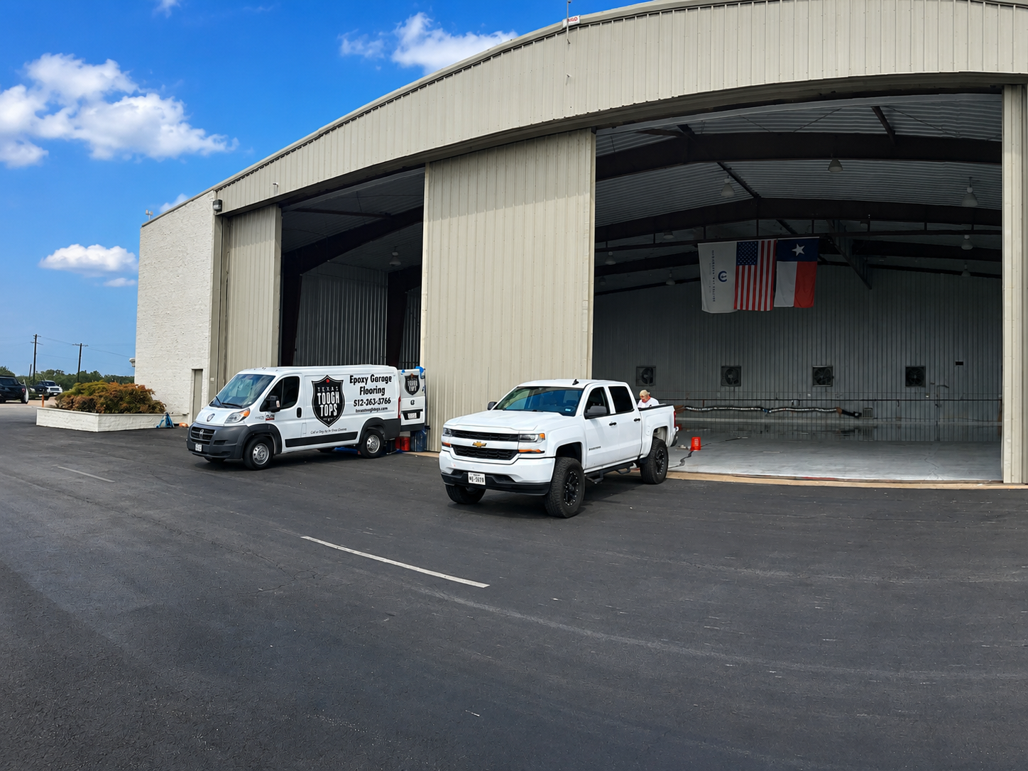 Texas Tough Tops trucks at airplane hangar